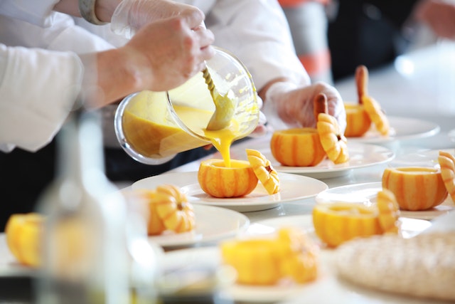 Chef Preparing Vegetable Dish on Tree Slab